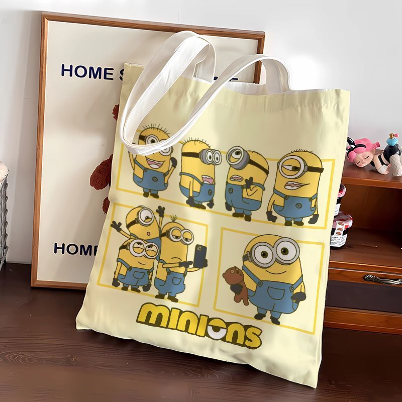 Anime Tote Bag - กระเป๋าผ้าแคนวาสลายการ์ตูนมินเนี่ยนน่ารัก กระเป๋าสะพายสำหรับนักเรียน กระเป๋าช้อปปิ้งพกพา กระเป๋าสะพายไหล่ ของขวัญ ขายส่ง
